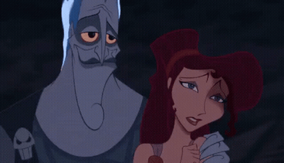 A Couple Of Cartoon Characters Standing Next To Each Other . GIF