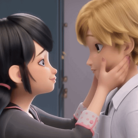 A Couple Of Cartoon Characters Touching Each Other 'S Face GIF