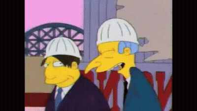 A Couple Of Cartoon Characters Wearing Hard Hats Standing Next To Each Other GIF