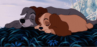 A Couple Of Cartoon Dogs Laying On Top Of Each Other GIF