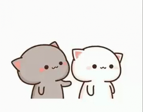 A Couple Of Cats Are Standing Next To Each Other And One Of Them Is Touching The Other 'S Face . GIF