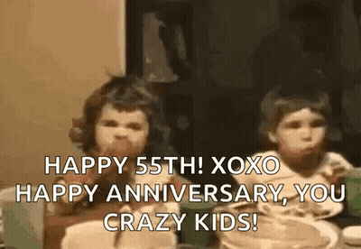 A Couple Of Children Are Sitting At A Table Eating Food And Talking . GIF