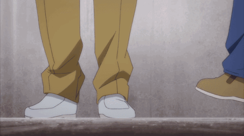 A Couple Of Feet Standing Next To Each Other On A Ledge GIF