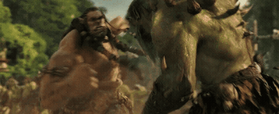 A Couple Of Giant Monsters Are Fighting Each Other In A Forest . GIF