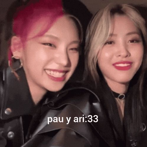 A Couple Of Girls Are Smiling With The Words Pau Y Ari : 33 On The Bottom Right GIF