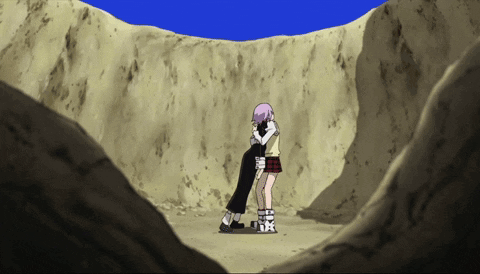 A Couple Of Girls Hugging Each Other In The Desert GIF