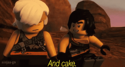 A Couple Of Lego Ninjago Characters Sitting Next To Each Other . GIF