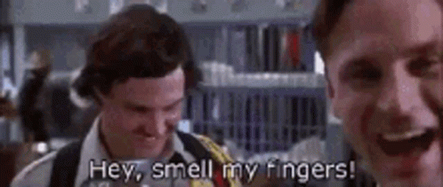 A Couple Of Men Are Standing Next To Each Other And One Of Them Is Saying `` Hey , Smell My Fingers '' . GIF