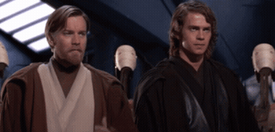 A Couple Of Men Standing Next To Each Other In A Room GIF
