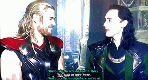 A Couple Of Men Standing Next To Each Other With One Saying Obviously There 'S All That History It 'S Kind Of Love Hate GIF
