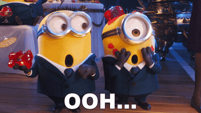 A Couple Of Minions Standing Next To Each Other With Ooh Written On The Bottom Right GIF