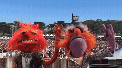 A Couple Of Muppets Standing Next To Each Other GIF