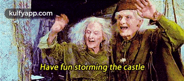 A Couple Of Old People Are Standing Next To Each Other With The Words Have Fun Storming The Castle On The Bottom GIF