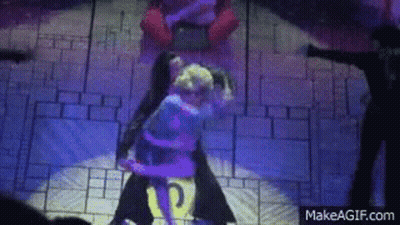 A Couple Of People Are Dancing On A Stage With A Makeagif.com Logo In The Corner . GIF