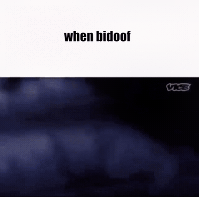 A Couple Of People Are Standing Next To Each Other In A Park . GIF