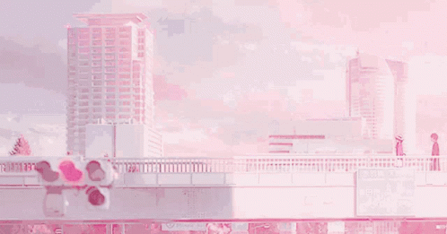 A Couple Of People Are Standing On A Bridge Over A River In Front Of A Pink Building . GIF