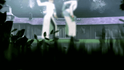 A Couple Of People Standing In Front Of A House With A Purple Roof GIF