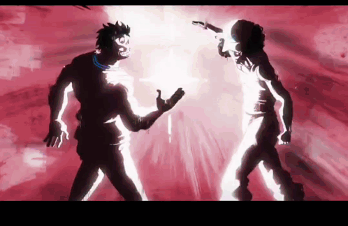 A Couple Of People Standing Next To Each Other With A Red Background GIF