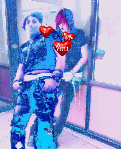 A Couple Of People Standing Next To Each Other With Hearts That Say Love You GIF