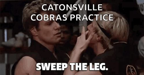 A Couple Of People Standing Next To Each Other With The Words Catonsville Cobras Practice Sweep The Leg Above Them GIF