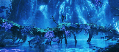 A Couple Of People Standing On A Bridge Over A River GIF