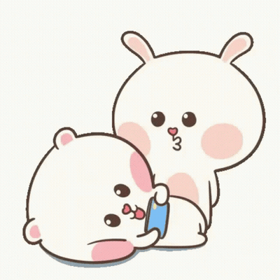 A Couple Of Rabbits Are Sitting Next To Each Other And Hugging Each Other . GIF