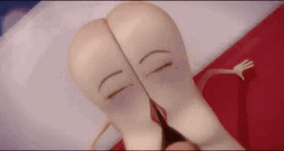 A Couple Of Sausages Are Laying On A Bed With Their Faces Drawn On Their Butts . GIF