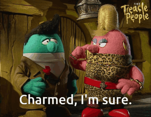 A Couple Of Stuffed Animals Standing Next To Each Other With The Words Charmed I 'M Sure GIF