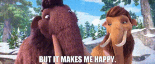 A Couple Of Stuffed Mammoths Standing Next To Each Other With The Words But It Makes Me Happy GIF