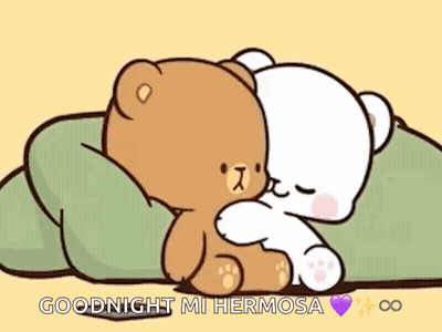 A Couple Of Teddy Bears Are Hugging Each Other On A Bed . GIF