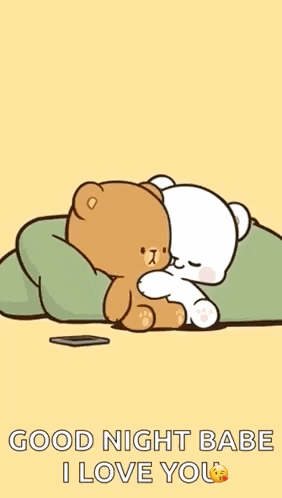 A Couple Of Teddy Bears Are Hugging Each Other On A Bed . GIF