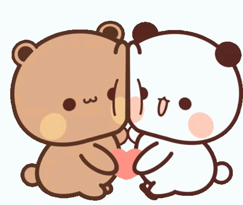 A Couple Of Teddy Bears Sitting Next To Each Other With One Holding A Heart GIF