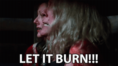 A Couple Of Women Are Sitting Next To Each Other With Their Faces Covered In Blood . GIF