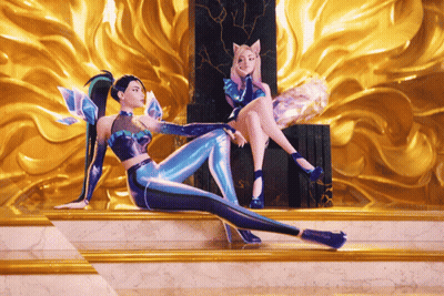 A Couple Of Women Sitting Next To Each Other On A Throne GIF