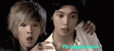 A Couple Of Young Men Standing Next To Each Other With The Words Fb.angel Leyva Written On The Bottom GIF
