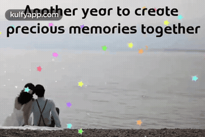 A Couple Sitting On The Beach With The Words Another Year To Create Precious Memories Together In The Background GIF