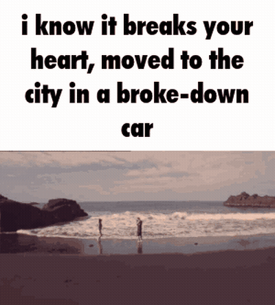 A Couple Standing On A Beach With The Words I Know It Breaks Your Heart Moved To The City In A Broke Down Car GIF