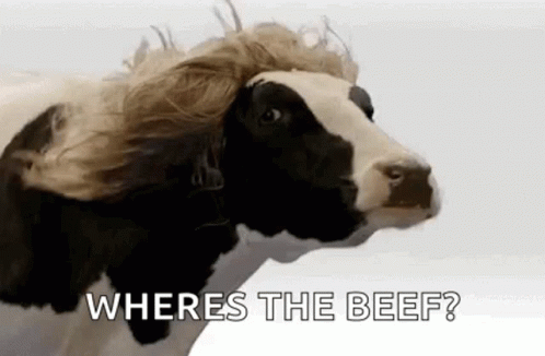 A Cow With A Wig On Its Head Is Asking Where Is The Beef . GIF
