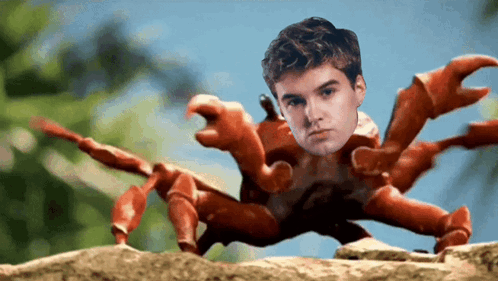 A Crab With A Man 'S Face On It 'S Claws GIF