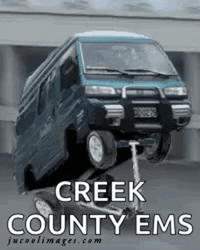 A Creek County Ems Poster With A Blue Van On A Scooter GIF