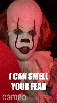 A Creepy Clown With The Words " I Can Smell Your Fear " Below It GIF