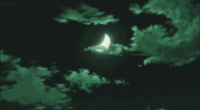 A Crescent Moon In A Dark Night Sky With Green Clouds . GIF
