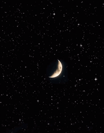 A Crescent Moon In A Starry Night Sky GIF