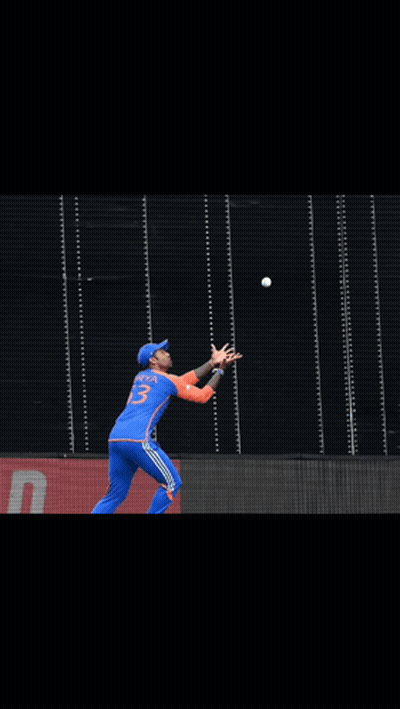 A Cricket Player Wearing A Blue Jersey With The Number 23 On It GIF