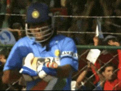 A Cricket Player Wearing A Blue Shirt That Says ' Ashes ' On The Sleeve GIF