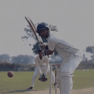 A Cricket Player Wearing A Helmet And Gloves With The Letters Sb On The Bat GIF