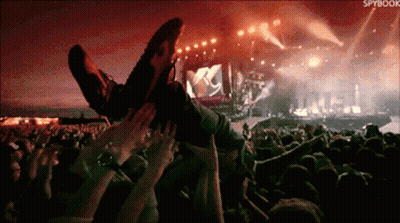 A Crowd At A Concert With The Word Spybook In The Corner GIF