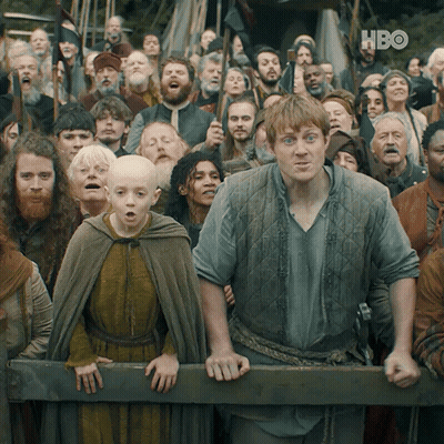 A Crowd Of People Are Gathered In Front Of A Fence With Hbo Written On The Bottom Right GIF