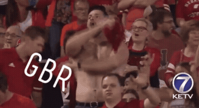 A Crowd Of People Are Watching A Game And One Of Them Is Wearing A Shirt That Says Gbr GIF