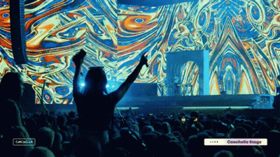 A Crowd Of People At A Concert With The Words Coachella On The Bottom GIF